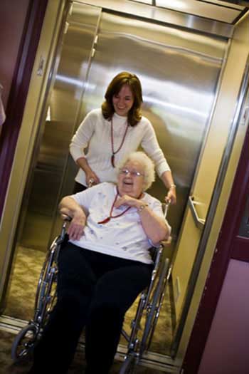 A senior getting a ride from an employee of the facility