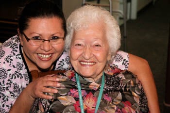 senior with a staff member