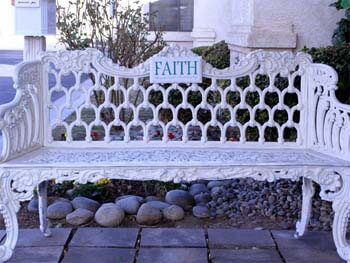 bench with a faith sign