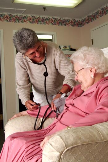 nurse helping a resident